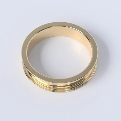 Gold ring on a white background, this ring is shaped like a wheel's rim, and shows the design without any "tyre"